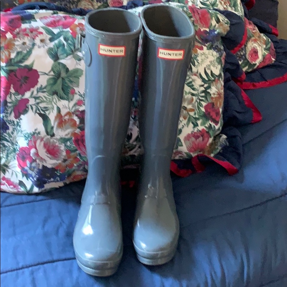 tall glossy grey rain boots